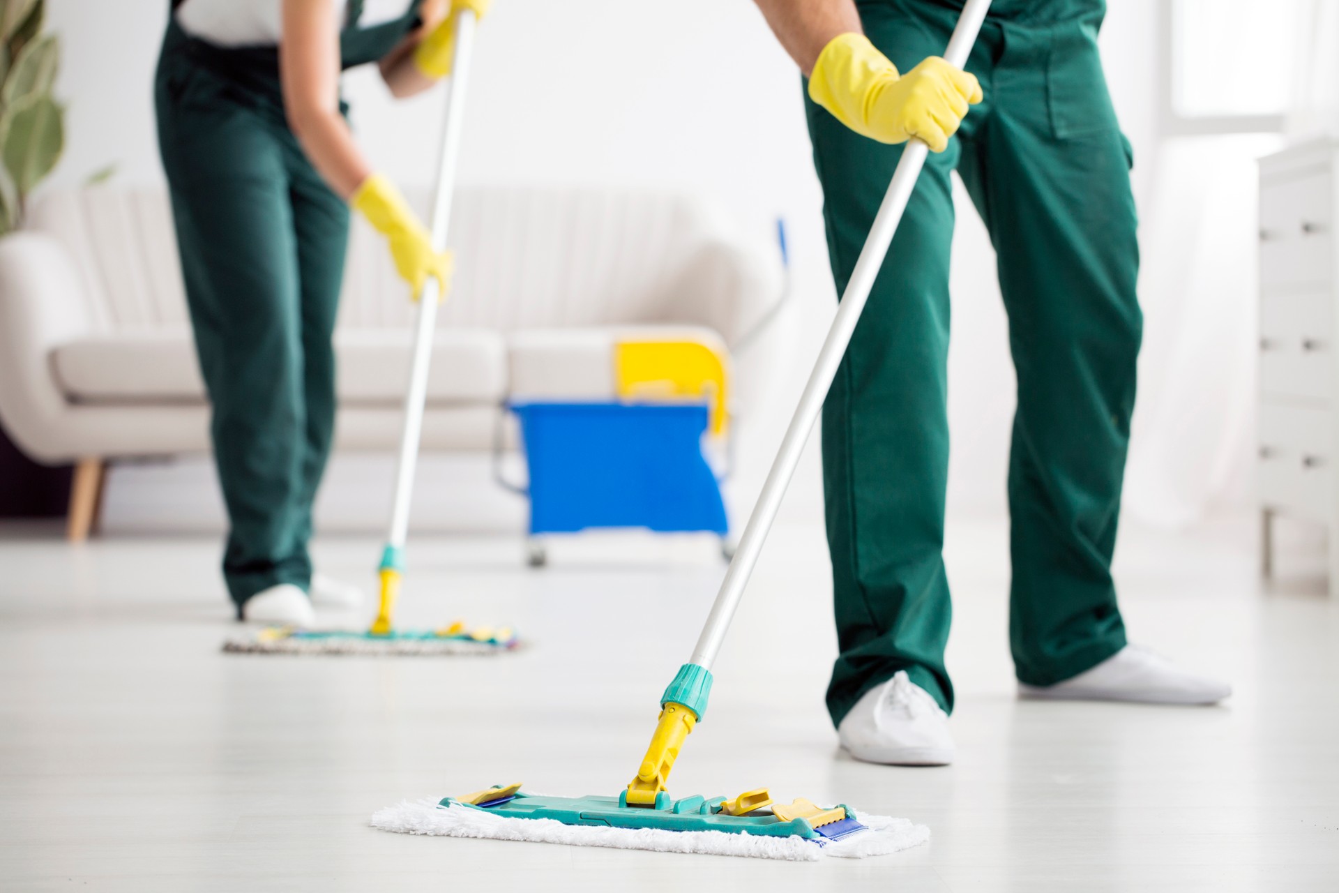 Cleaning team wiping the floor